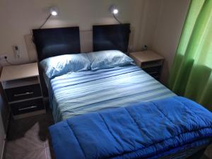 Un pat sau paturi într-o cameră la Cabañas La que Brilla