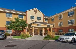 a building with a car parked in front of it at Extended Stay America Suites - Salt Lake City - Union Park in Midvale