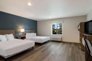 Postel nebo postele na pokoji v ubytování WoodSpring Suites Olympia - Lacey