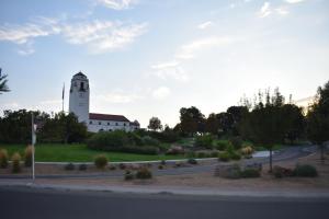 a building with a clock tower on the side of a road at BSU Playland 2bd 1b Fully Remodeled on Bsu Campus in Boise