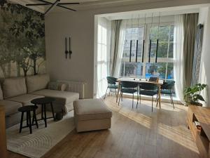 a living room with a couch and a table at MIRA Apartment in My Center in Szczecin