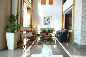 a living room with a couch and a table at The Place Gurugram, a member of Radisson Individuals in Gurgaon