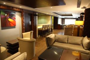 a living room with a couch and a table at The Place Gurugram, a member of Radisson Individuals in Gurgaon