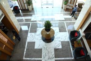 an overhead view of a lobby with a potted plant at The Place Gurugram, a member of Radisson Individuals in Gurgaon