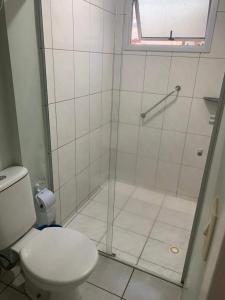a bathroom with a shower and a toilet at Thermas Place- Caldas Novas(512) in Caldas Novas