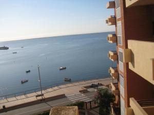 a view of a large body of water from a building at AMPOLLA in L'Ampolla