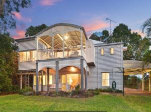 a large house with a large balcony on top of it at Buderim Milne House in Buderim