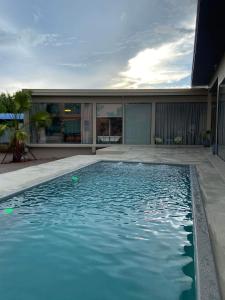 a swimming pool in the middle of a house at Alley51 Hotel in Surat Thani