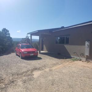 a red car parked in front of a house at Anasazi Retreat 
