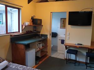 TV o dispositivi per l'intrattenimento presso Glow Worm Accommodation