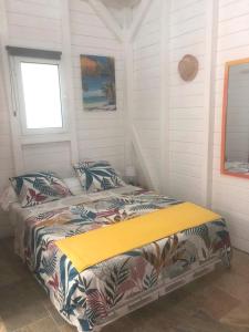 a bedroom with a bed in a room at Casamango in Basse-Terre