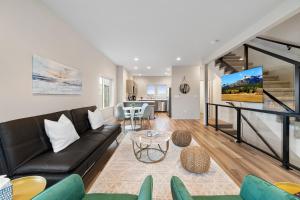 a living room with a couch and a table at Brand New Fully Updated Condo 904 in Anacortes in Anacortes