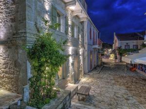 an empty street in a town at night at Fiscardonna Luxury Suites in Fiskardo