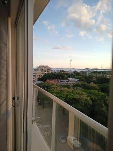 a balcony with a view of a city at Simply the most comfortable place next to Boca Chica beach in Boca Chica