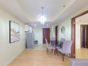 a kitchen and dining room with a table and chairs at 1 Bedroom Suite-City View-Horizons in Cebu City