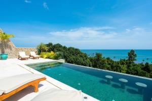 a swimming pool with a view of the ocean at 20% OFF ! 200 m to the Beach, 180° Amazing Seaview in Ban Tai