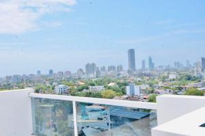 a view of a city from the balcony of a building at SkyGate Residences in Nugegoda