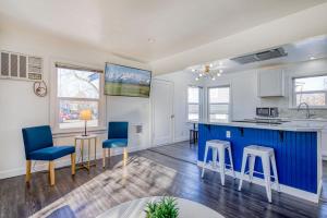 a kitchen with a blue island and chairs in a room at New Downtown Boise on Bsu Campus 3 Beds Sleeps 6 in Boise