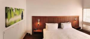 Ramada By Wyndham Cairns City Centre客房内的一张或多张床位