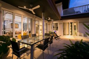 a dining room with a glass table and chairs at Katamanda Villa Mila A1 near Kata Beach in Kata Beach