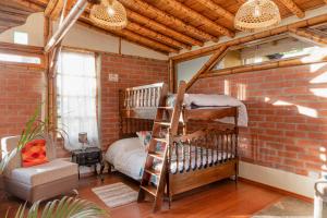 Postel nebo postele na pokoji v ubytování Hostería Colibri Aeropuerto