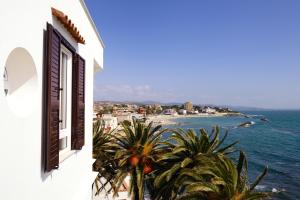 a window of a building with a view of the ocean at Villa delle Palme in Santa Marinella