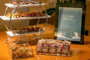 a display of cookies and other snacks on a table at Kobe Meriken Park Oriental Hotel in Kobe