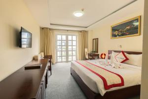 Voodi või voodid majutusasutuse Tien Sa Danang Hotel toas