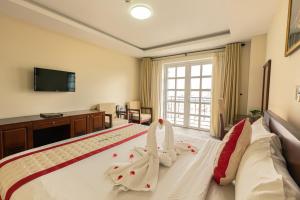 Voodi või voodid majutusasutuse Tien Sa Danang Hotel toas