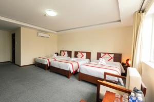 Voodi või voodid majutusasutuse Tien Sa Danang Hotel toas