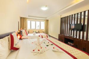 Voodi või voodid majutusasutuse Tien Sa Danang Hotel toas