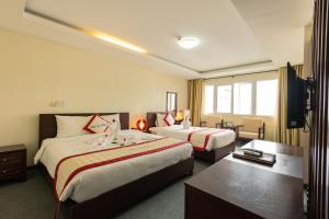Voodi või voodid majutusasutuse Tien Sa Danang Hotel toas