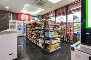a grocery store aisle with products on display at Eastern Hotel Jeju in Seogwipo