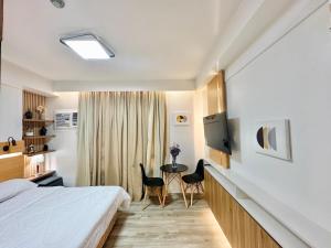 Giường trong phòng chung tại UNIT B218
