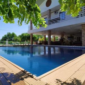 a large swimming pool in front of a building at Amanzara Bohol Resort in Bolod