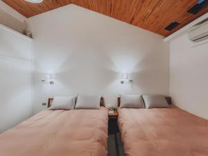 桃園包棟-我愛你學田民宿 I Love Natural Life Homestay客房内的一张或多张床位
