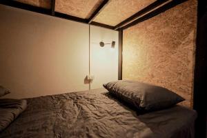 Postel nebo postele na pokoji v ubytování ANOU HOSTEL