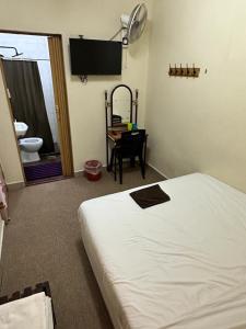 Postel nebo postele na pokoji v ubytování Hotel BB Inn @ Cameron