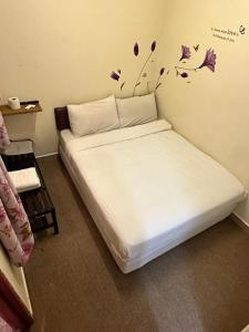 Postel nebo postele na pokoji v ubytování Hotel BB Inn @ Cameron