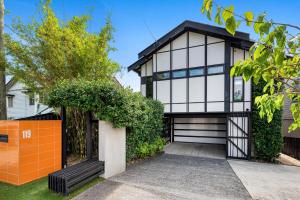 a house with a black and white facade at Fairfield Palace in Brisbane