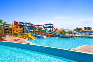 a water park with a water slide and a pool at Pickalbatros Jungle Aqua Park - Neverland Hurghada in Hurghada
