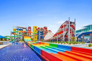 a roller coaster at a amusement park with a roller coaster at Pickalbatros Jungle Aqua Park - Neverland Hurghada in Hurghada