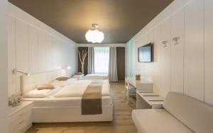Postel nebo postele na pokoji v ubytování Hotel Lener