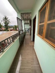a hallway of a house with a balcony at Résidence Agnès et Victor (RAV) in Bangui