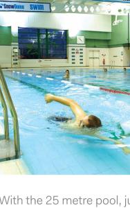 a woman swimming in a swimming pool in a gym at Home from home midlands in Glascote