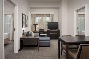 a living room with a couch and a tv at Residence Inn Birmingham Hoover in Hoover
