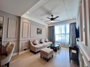 a living room with a couch and a table at Luxury Apartment in Da Nang