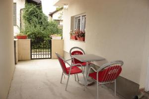 a table and chairs sitting on a patio at Apartmani Villas in Visoko