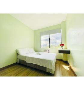 Ένα ή περισσότερα κρεβάτια σε δωμάτιο στο OYO 1008 Armond Bed And Breakfast
