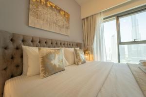 Postel nebo postele na pokoji v ubytování Luxury Living: Stunning 3-Bedroom Apartment in Downtown